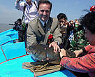 WWF China Country Representative Dermot O'Gorman pauses for a photo before releasing a parent carp into the Yangtze River. 